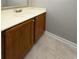 Bathroom featuring a wood cabinet with a cream-colored sink and countertop at 112 3Rd Ave. S # B, Surfside Beach, SC 29575