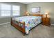 Bedroom with a bed and bedside tables near a window at 112 3Rd Ave. S # B, Surfside Beach, SC 29575