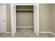 Empty closet featuring bi-fold doors and carpet flooring at 112 3Rd Ave. S # B, Surfside Beach, SC 29575