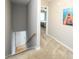Upstairs hallway featuring carpet and access to the basement, laundry and the bedrooms at 112 3Rd Ave. S # B, Surfside Beach, SC 29575