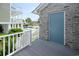 A pool side entrance of a gray brick building near an outdoor swimming pool at 112 3Rd Ave. S # B, Surfside Beach, SC 29575