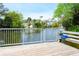 Picturesque water view from a wooden dock with a bench, showcasing the natural beauty of the surroundings at 112 3Rd Ave. S # B, Surfside Beach, SC 29575
