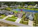 Aerial view of the home featuring a pond, manicured lawns, and neighborhood houses at 1133 6Th Ave. S, North Myrtle Beach, SC 29582