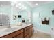 Bathroom featuring double sinks, plenty of counter space, and a large mirror at 1133 6Th Ave. S, North Myrtle Beach, SC 29582