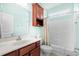 Bathroom with vanity, mirror, and a shower-tub combo, offering functionality and style at 1133 6Th Ave. S, North Myrtle Beach, SC 29582