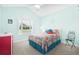 Bright bedroom with a colorful bedspread, window, and seating, creating a cheerful space at 1133 6Th Ave. S, North Myrtle Beach, SC 29582