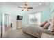Relaxing bedroom featuring a ceiling fan, closet, and view of the backyard pool at 1133 6Th Ave. S, North Myrtle Beach, SC 29582
