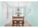 Charming dining area with natural light and stylish furnishings by the window at 1133 6Th Ave. S, North Myrtle Beach, SC 29582