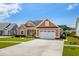 Charming home boasting manicured landscaping, a two-car garage, neutral siding, and a concrete driveway at 1133 6Th Ave. S, North Myrtle Beach, SC 29582