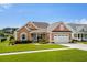Charming single-story home with well-manicured lawn and attached two-car garage at 1133 6Th Ave. S, North Myrtle Beach, SC 29582