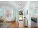 Bright and airy foyer with hardwood floors, modern light fixture, and views of the dining area at 1133 6Th Ave. S, North Myrtle Beach, SC 29582