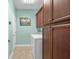 Laundry room with washer, dryer, and ample cabinet storage for organization and convenience at 1133 6Th Ave. S, North Myrtle Beach, SC 29582