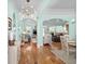 Open-concept living area with hardwood floors, stylish furnishings, and views of the kitchen and dining area at 1133 6Th Ave. S, North Myrtle Beach, SC 29582