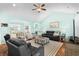 Inviting living room featuring a high ceiling, hardwood floors, and comfortable seating at 1133 6Th Ave. S, North Myrtle Beach, SC 29582