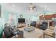 Spacious living room with hardwood floors, comfortable seating, and open access to the kitchen at 1133 6Th Ave. S, North Myrtle Beach, SC 29582