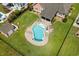Aerial view of the backyard pool with a waterfall feature, shed, and patio area for entertaining at 1133 6Th Ave. S, North Myrtle Beach, SC 29582