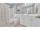 Well-lit bathroom with a shower/tub combo, a spacious vanity, and modern fixtures at 1203 Crooked Oak Dr., Pawleys Island, SC 29585