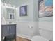 Neatly decorated powder room with modern vanity and a clean, refreshing ambiance at 1203 Crooked Oak Dr., Pawleys Island, SC 29585