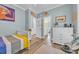 Charming bedroom with playful decor, hardwood floors, and plenty of natural light at 1203 Crooked Oak Dr., Pawleys Island, SC 29585