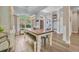 Inviting dining area filled with natural light, complemented by tasteful decor and hardwood flooring at 1203 Crooked Oak Dr., Pawleys Island, SC 29585