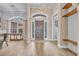 Elegant foyer showcasing hardwood floors and architectural details, enhanced by natural light at 1203 Crooked Oak Dr., Pawleys Island, SC 29585