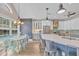 Open kitchen and dining area with stainless steel appliances, modern cabinetry, and pool view at 1203 Crooked Oak Dr., Pawleys Island, SC 29585