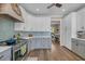 Stylish kitchen with stainless steel appliances, modern cabinets, and view to the dining room at 1203 Crooked Oak Dr., Pawleys Island, SC 29585