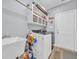Functional laundry room with modern appliances, shelving, and ample storage space at 1203 Crooked Oak Dr., Pawleys Island, SC 29585
