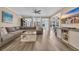 Spacious living room featuring hardwood floors and an open layout with lots of natural light at 1203 Crooked Oak Dr., Pawleys Island, SC 29585