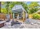 Charming outbuilding with a porch, wood details, and an outdoor seating area at 1203 Crooked Oak Dr., Pawleys Island, SC 29585