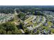Aerial view of a community featuring single-Gathering homes with tree-lined streets, and neighborhood pond at 1220 Alcazar Ct., Conway, SC 29527