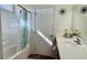 Bright bathroom featuring white countertops, wooden cabinets and tub with shower at 1220 Alcazar Ct., Conway, SC 29527