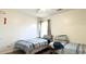 Bedroom featuring two twin beds with blue striped bedding, a window, and light hardwood floors at 1220 Alcazar Ct., Conway, SC 29527
