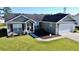 Charming single Gathering home with two-car garage, manicured lawn and attractive landscaping at 1220 Alcazar Ct., Conway, SC 29527