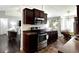 A view of the kitchen with stainless steel appliances and dark brown cabinets at 1220 Alcazar Ct., Conway, SC 29527