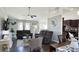 Inviting living room features dark wood flooring, ceiling fan and plenty of natural light at 1220 Alcazar Ct., Conway, SC 29527