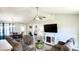 Open concept living room flows seamlessly into dining room featuring vaulted ceiling and dark wood floor at 1220 Alcazar Ct., Conway, SC 29527