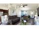 Open concept living room featuring vaulted ceiling, ceiling fan, dark wood floor and grey walls at 1220 Alcazar Ct., Conway, SC 29527