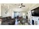 Open concept living room featuring vaulted ceiling, ceiling fan, dark wood floor and grey walls at 1220 Alcazar Ct., Conway, SC 29527
