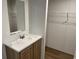 A bathroom with a vanity and sink offers a simple design at 1242 Carrie Bell Ln, Myrtle Beach, SC 29577
