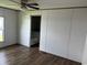 An empty bedroom with hardwood floors offers the chance to customize at 1242 Carrie Bell Ln, Myrtle Beach, SC 29577