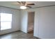 Bright bedroom features wood-look flooring, a ceiling fan, and a closet entrance at 1242 Carrie Bell Ln, Myrtle Beach, SC 29577
