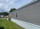Exterior view of manufactured home featuring gray siding at 1242 Carrie Bell Ln, Myrtle Beach, SC 29577