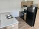 Kitchen with island and sink, black appliances, and bright countertops at 1242 Carrie Bell Ln, Myrtle Beach, SC 29577