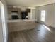 Modern open kitchen and living area featuring new appliances and breakfast bar at 1242 Carrie Bell Ln, Myrtle Beach, SC 29577