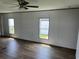 An empty living room with hardwood floors offers the chance to customize at 1242 Carrie Bell Ln, Myrtle Beach, SC 29577