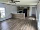 Open Living room and Kitchen with luxury vinyl flooring and lots of light at 1242 Carrie Bell Ln, Myrtle Beach, SC 29577