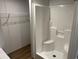 A stand-up shower with a built-in seat offers a modern design at 1242 Carrie Bell Ln, Myrtle Beach, SC 29577