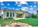 Spacious backyard featuring lush green lawn, fire pit, and fenced perimeter at 1286 Culbertson Ave., Myrtle Beach, SC 29577