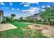 Well-manicured backyard with green lawn and a stone fire pit at 1286 Culbertson Ave., Myrtle Beach, SC 29577